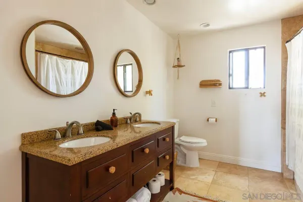 a bathroom with a tub a sink and a shower