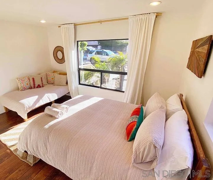 837 4th Street Encinitas, CA 92024 - Photo 31 of 41 a bedroom with a bed and a large window