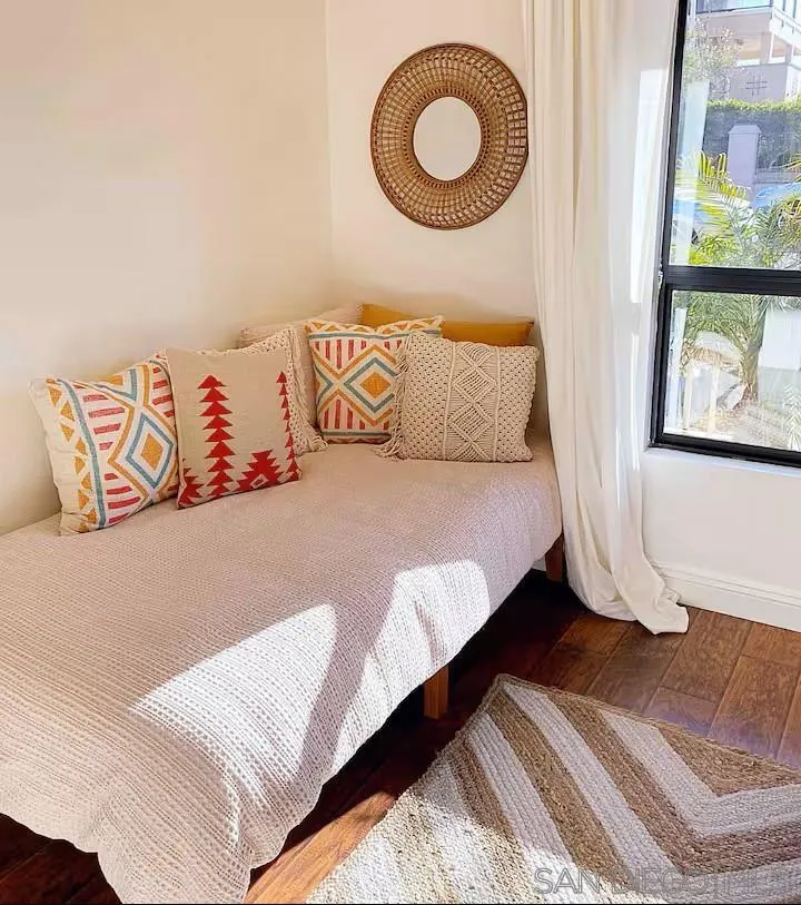 837 4th Street Encinitas, CA 92024 - Photo 32 of 41 a bedroom with a bed and a painting on the wall