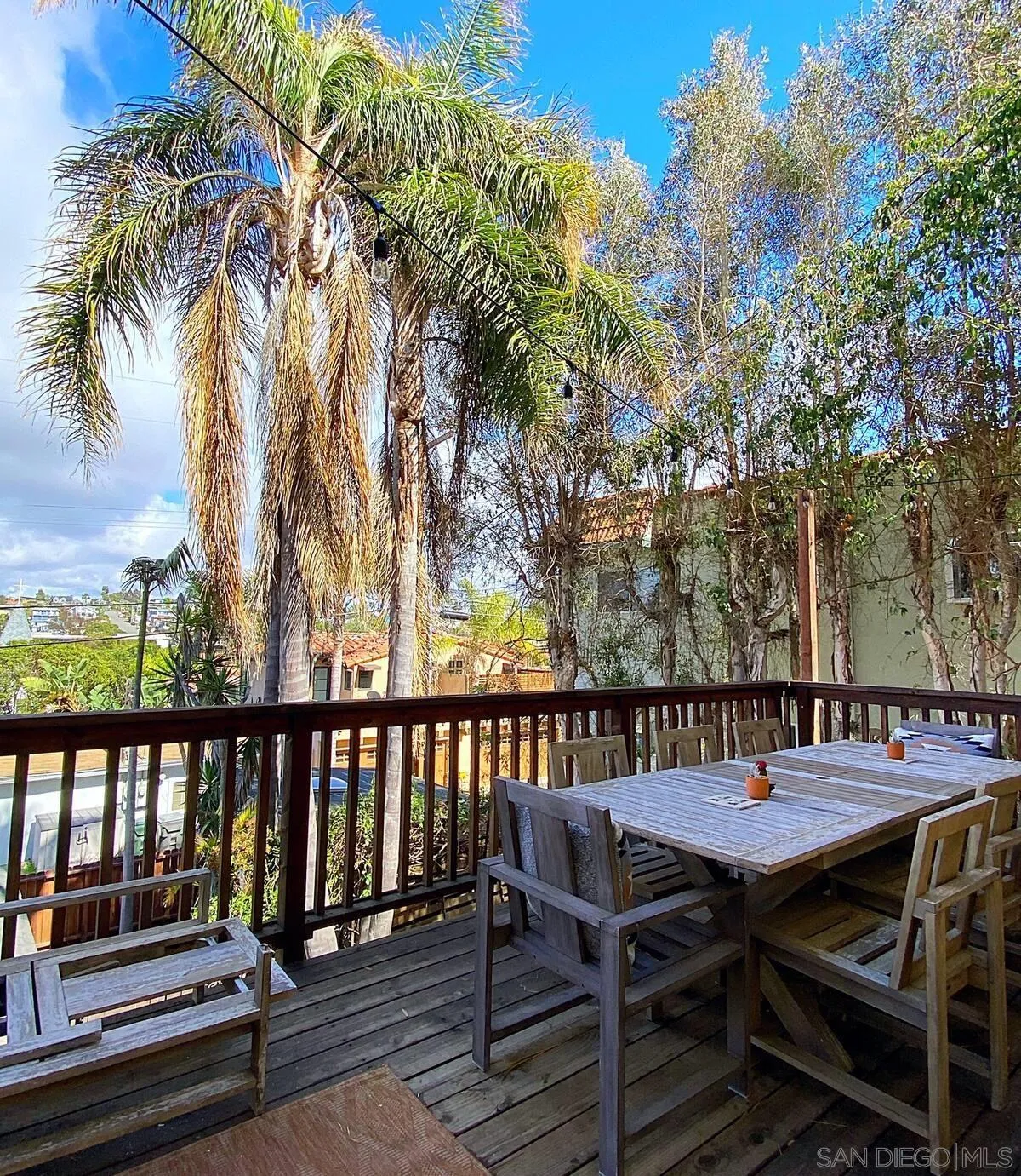 837 4th Street Encinitas, CA 92024 - Photo 36 of 41 a view of a chairs and table on the deck