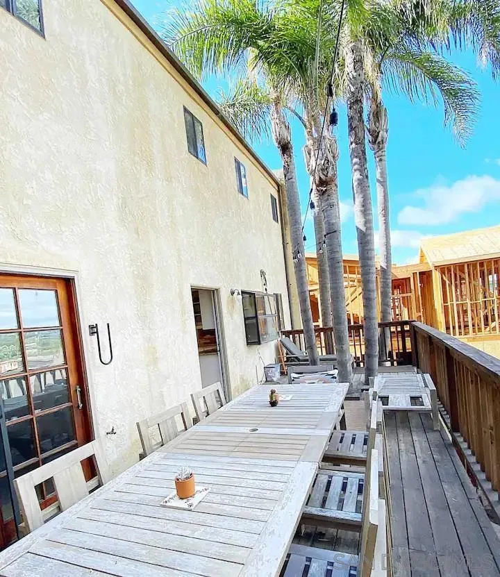 837 4th Street Encinitas, CA 92024 - Photo 37 of 41 a view of a balcony with chairs and wooden floor