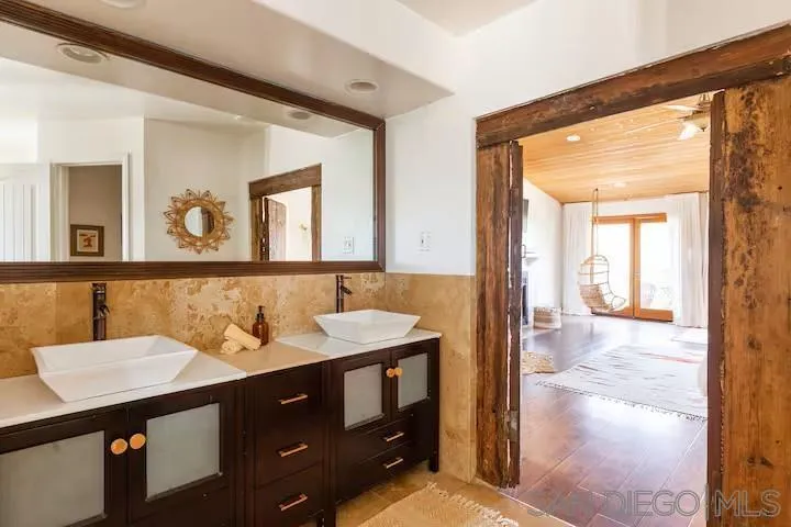 837 4th Street Encinitas, CA 92024 - Photo 4 of 41 a bathroom with a sink and a mirror