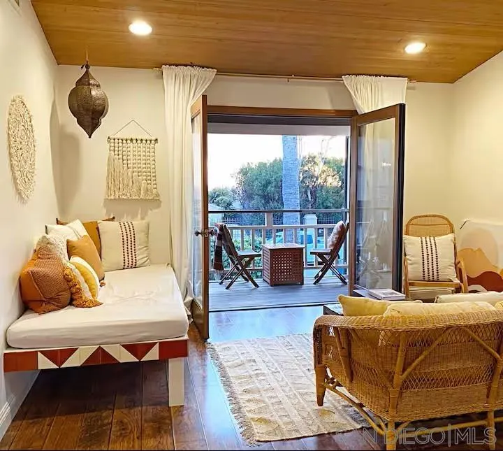 837 4th Street Encinitas, CA 92024 - Photo 5 of 41 a bedroom with furniture and a large window