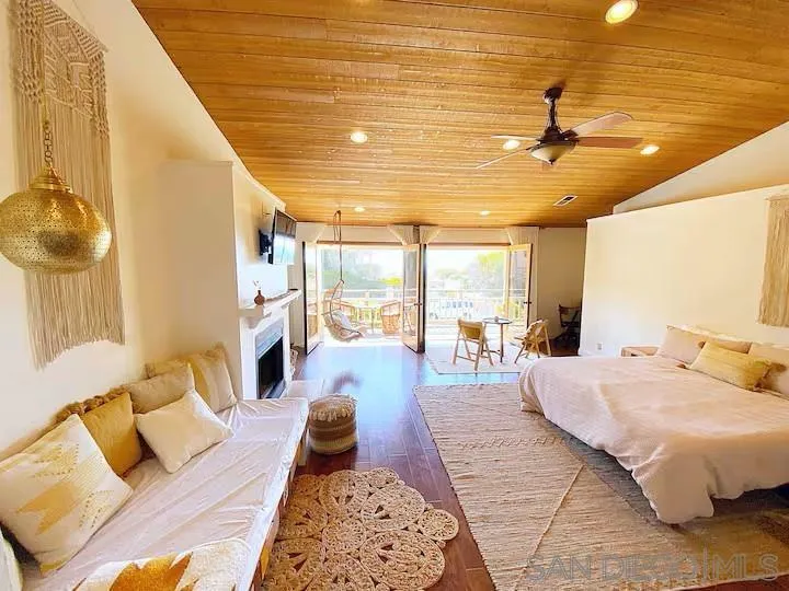 837 4th Street Encinitas, CA 92024 - Photo 6 of 41 a large bedroom with a bed and large windows