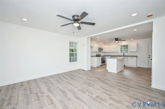 a view of a kitchen with a sink and cabinet