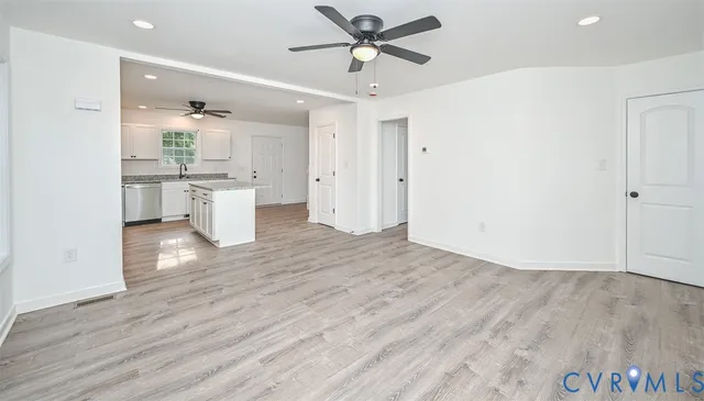 a view of kitchen with wooden floor and window