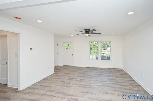 an empty room that has a window in it