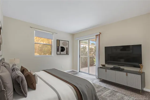 a bed room with furniture and a window