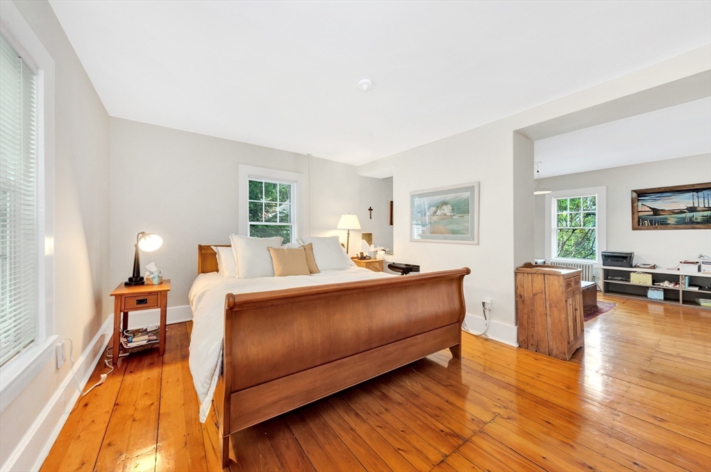 11 Maynard Place Cambridge, MA 02138 - Photo 16 of 26 a living room with furniture and a wooden floor