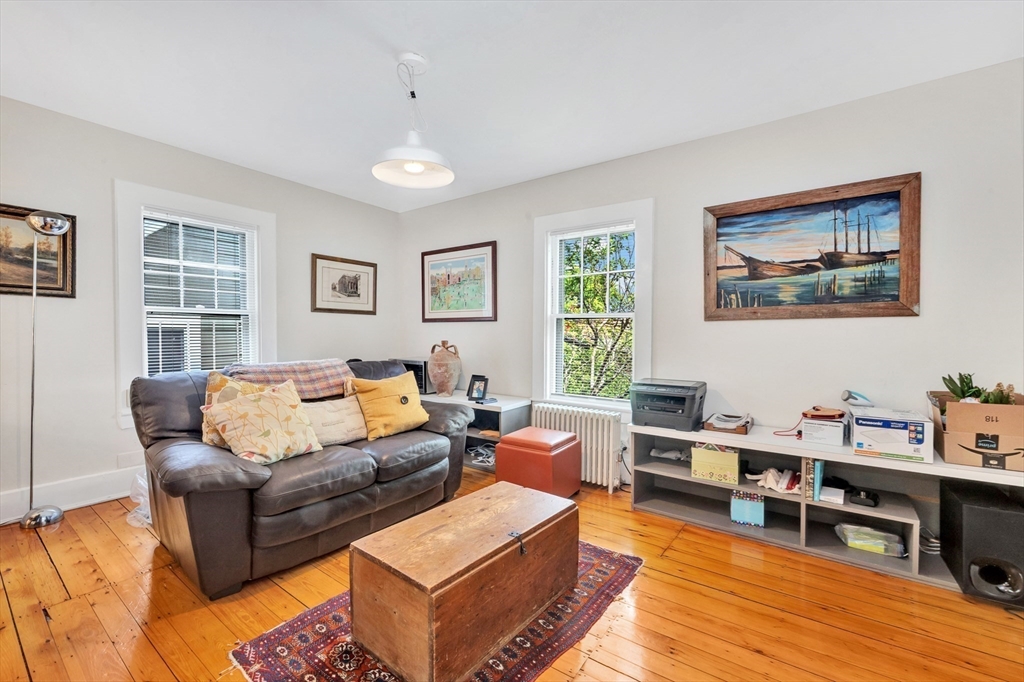 11 Maynard Place Cambridge, MA 02138 - Photo 17 of 26 a living room with furniture and a wooden floor