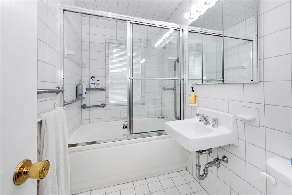 11 Maynard Place Cambridge, MA 02138 - Photo 19 of 26 a bathroom with a sink and mirror