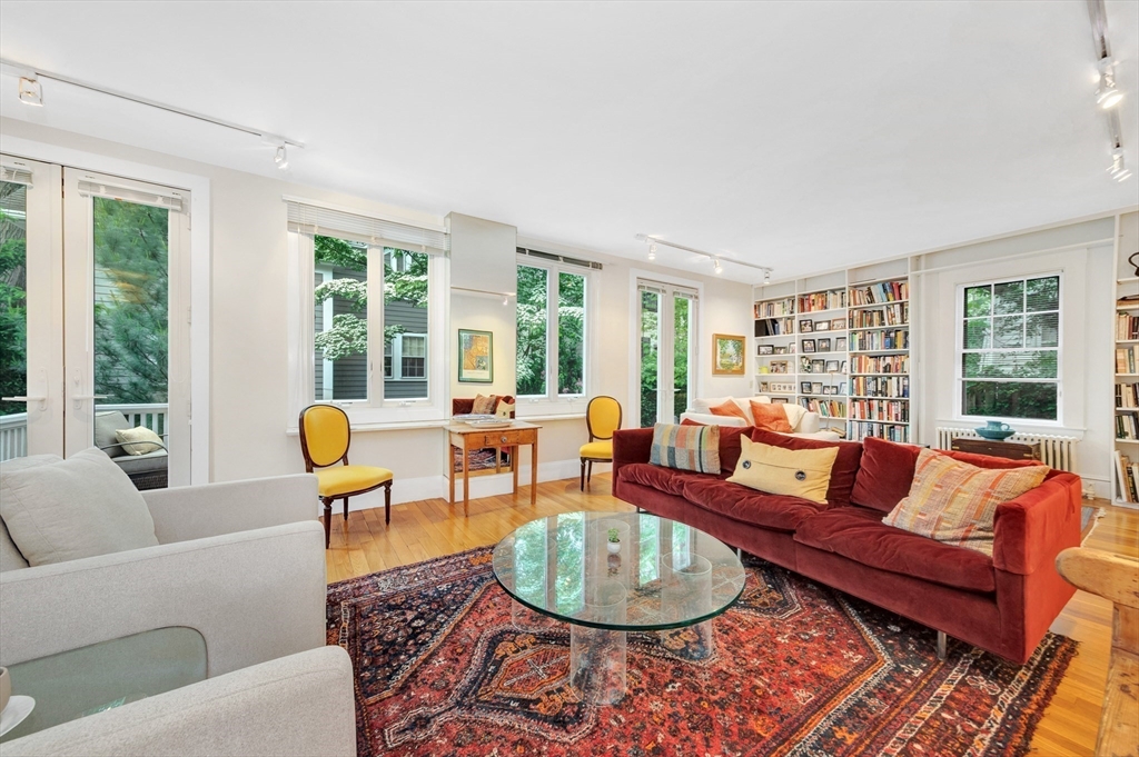 11 Maynard Place Cambridge, MA 02138 - Photo 3 of 26 a living room with furniture and a large window