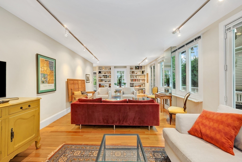 11 Maynard Place Cambridge, MA 02138 - Photo 8 of 26 a living room with furniture and a large window