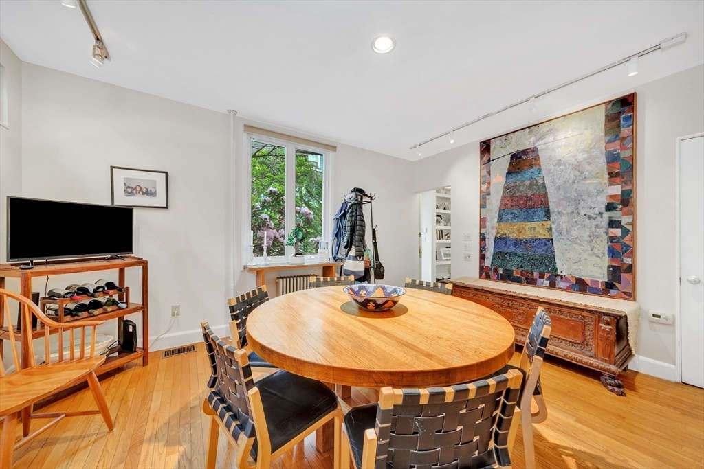 11 Maynard Place Cambridge, MA 02138 - Photo 10 of 26 a dining room with furniture and a flat screen tv