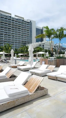 a view of swimming pool with outdoor seating