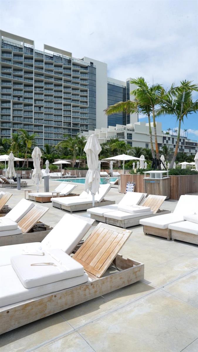 2301 Collins Avenue, Unit 836 Miami Beach, FL 33139 - Photo 17 of 29 a view of swimming pool with outdoor seating