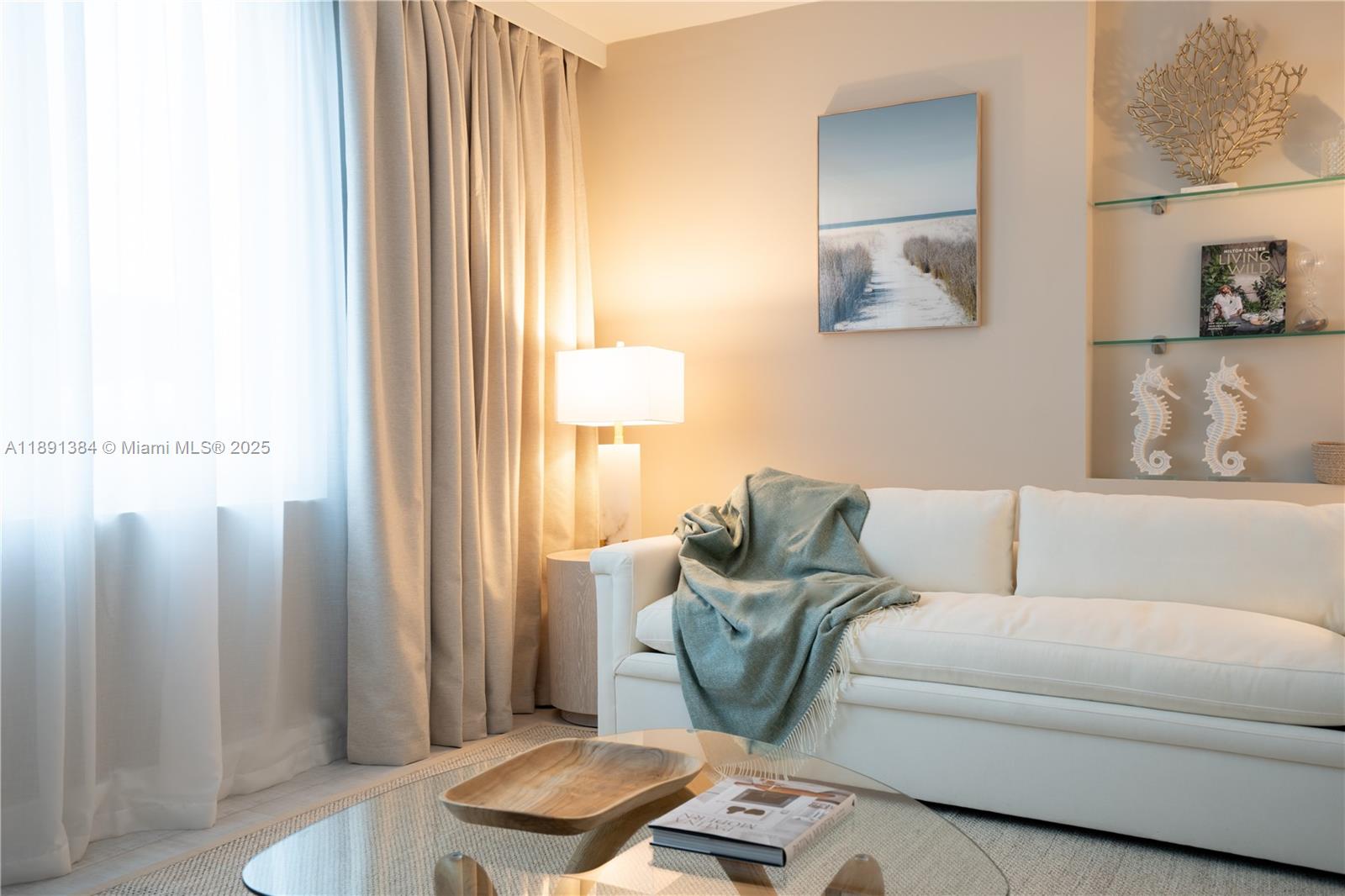 2301 Collins Avenue, Unit 836 Miami Beach, FL 33139 - Photo 2 of 29 a living room with furniture and a window