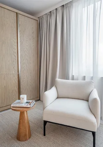 a living room with furniture and a bathtub