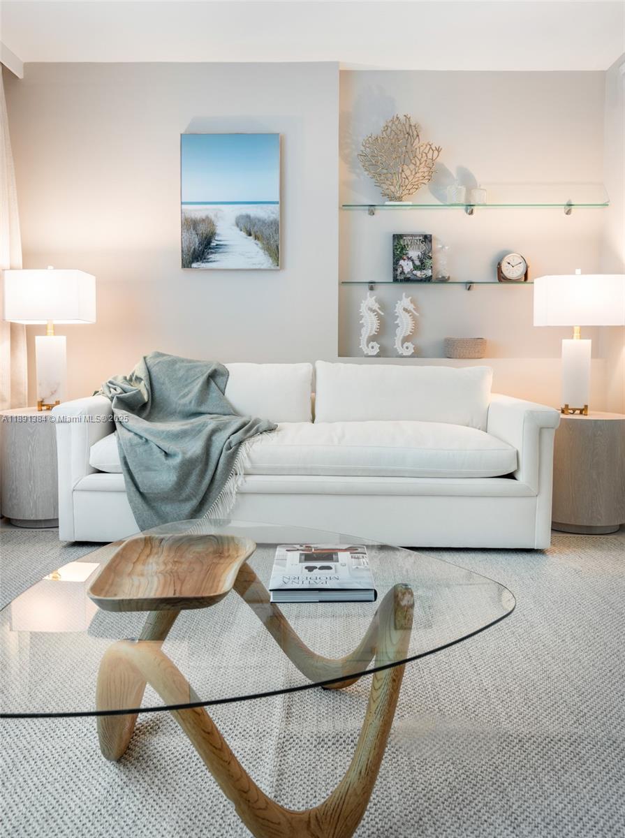 2301 Collins Avenue, Unit 836 Miami Beach, FL 33139 - Photo 4 of 29 a living room with furniture and a couch