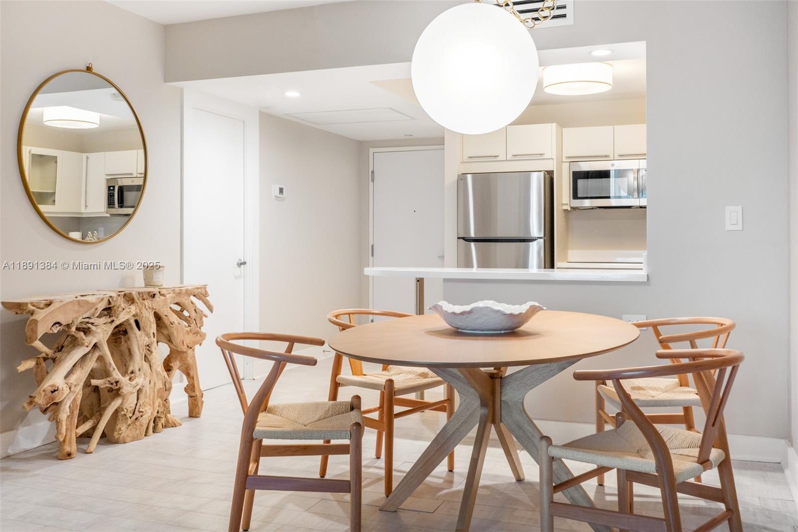 2301 Collins Avenue, Unit 836 Miami Beach, FL 33139 - Photo 6 of 29 a view of a dining room with furniture and wooden floor