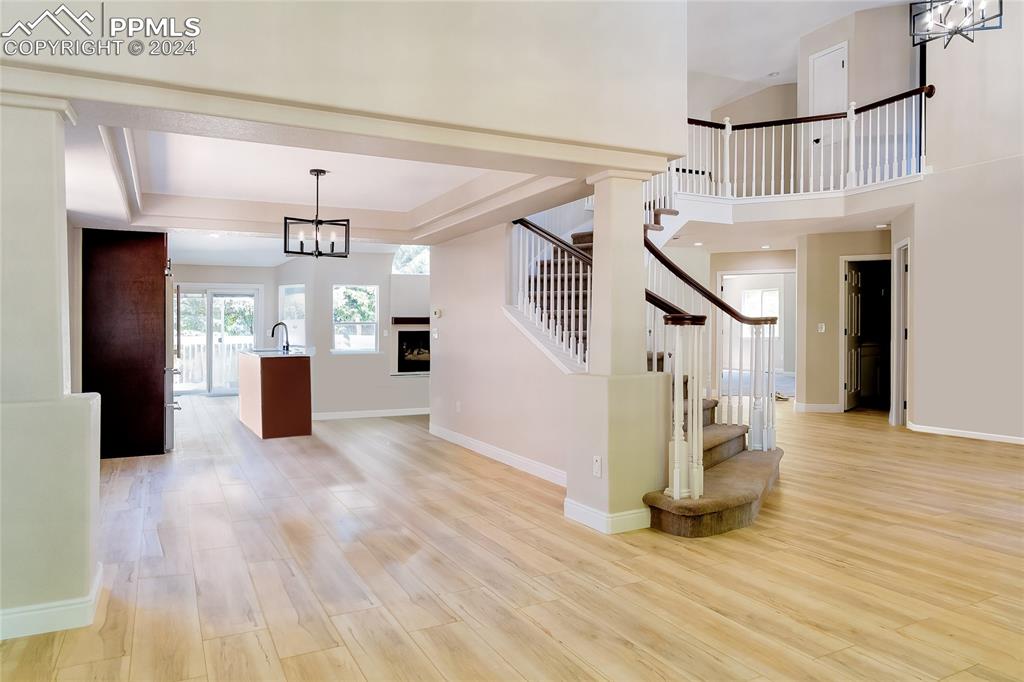 7873 Sweet Water Road Lone Tree, CO 80124 - Photo 13 of 48 a view of entryway and hall with wooden floor