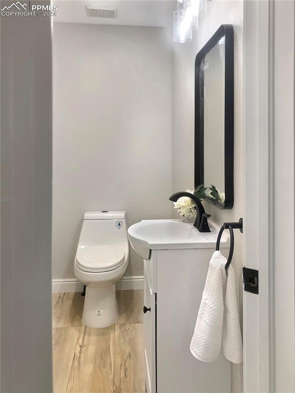 7873 Sweet Water Road Lone Tree, CO 80124 - Photo 14 of 48 a bathroom with a toilet and a mirror