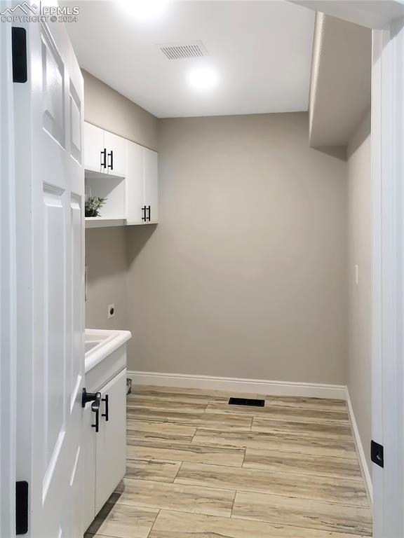 7873 Sweet Water Road Lone Tree, CO 80124 - Photo 15 of 48 a view of empty room with wooden floor