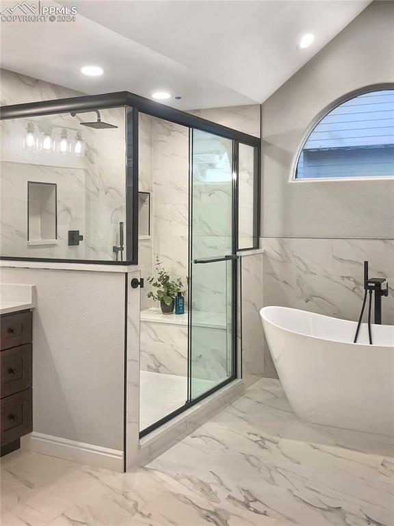 7873 Sweet Water Road Lone Tree, CO 80124 - Photo 18 of 48 a bathroom with a bathtub and a shower