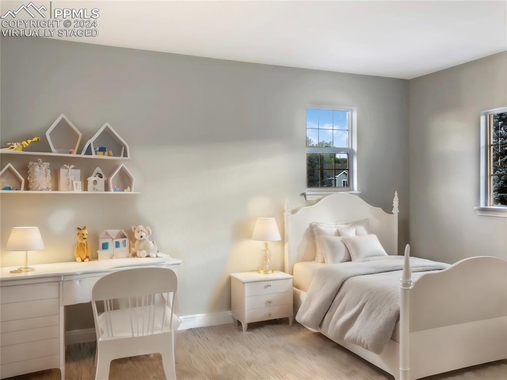 7873 Sweet Water Road Lone Tree, CO 80124 - Photo 24 of 48 a bedroom with furniture and a window