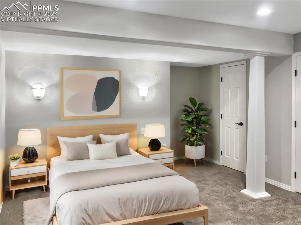 7873 Sweet Water Road Lone Tree, CO 80124 - Photo 35 of 48 a bedroom with a bed and a potted plant