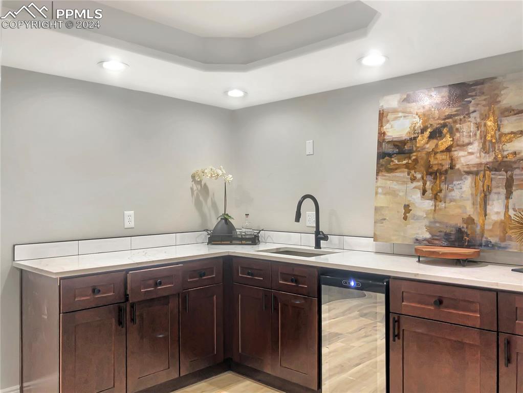 7873 Sweet Water Road Lone Tree, CO 80124 - Photo 36 of 48 a kitchen with a sink and cabinets