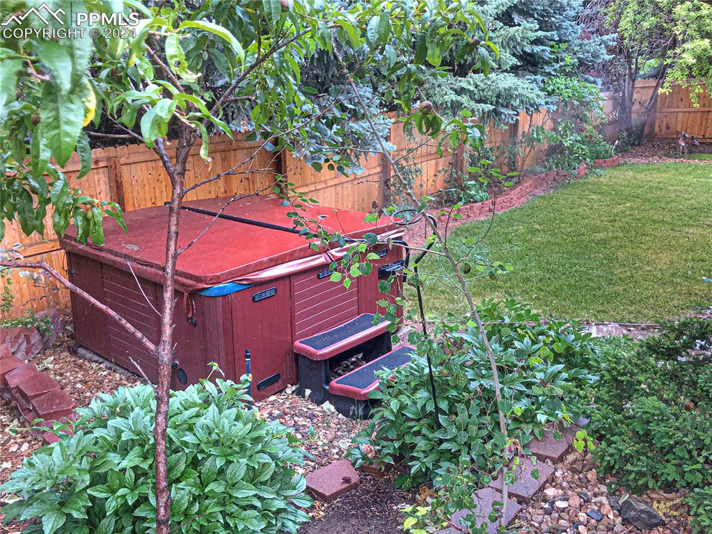 7873 Sweet Water Road Lone Tree, CO 80124 - Photo 38 of 48 a backyard of a house with lots of green space and fountain