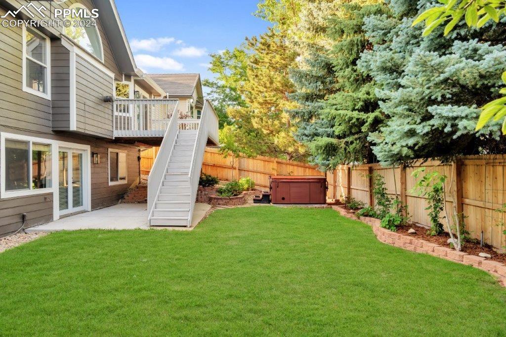 7873 Sweet Water Road Lone Tree, CO 80124 - Photo 40 of 48 a view of a house with a yard and sitting area