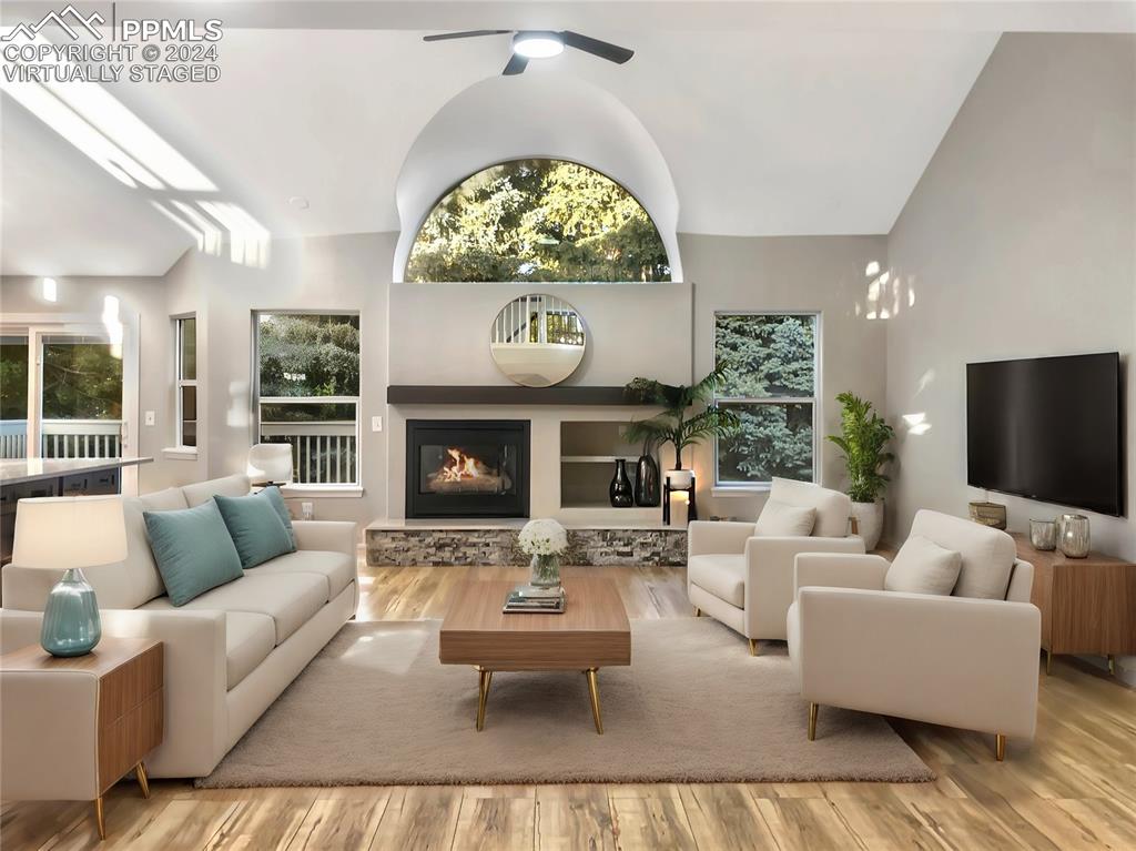 7873 Sweet Water Road Lone Tree, CO 80124 - Photo 4 of 48 a living room with fireplace furniture and a flat screen tv
