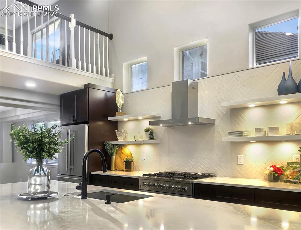 7873 Sweet Water Road Lone Tree, CO 80124 - Photo 7 of 48 a kitchen with stainless steel appliances granite countertop a sink refrigerator and cabinets