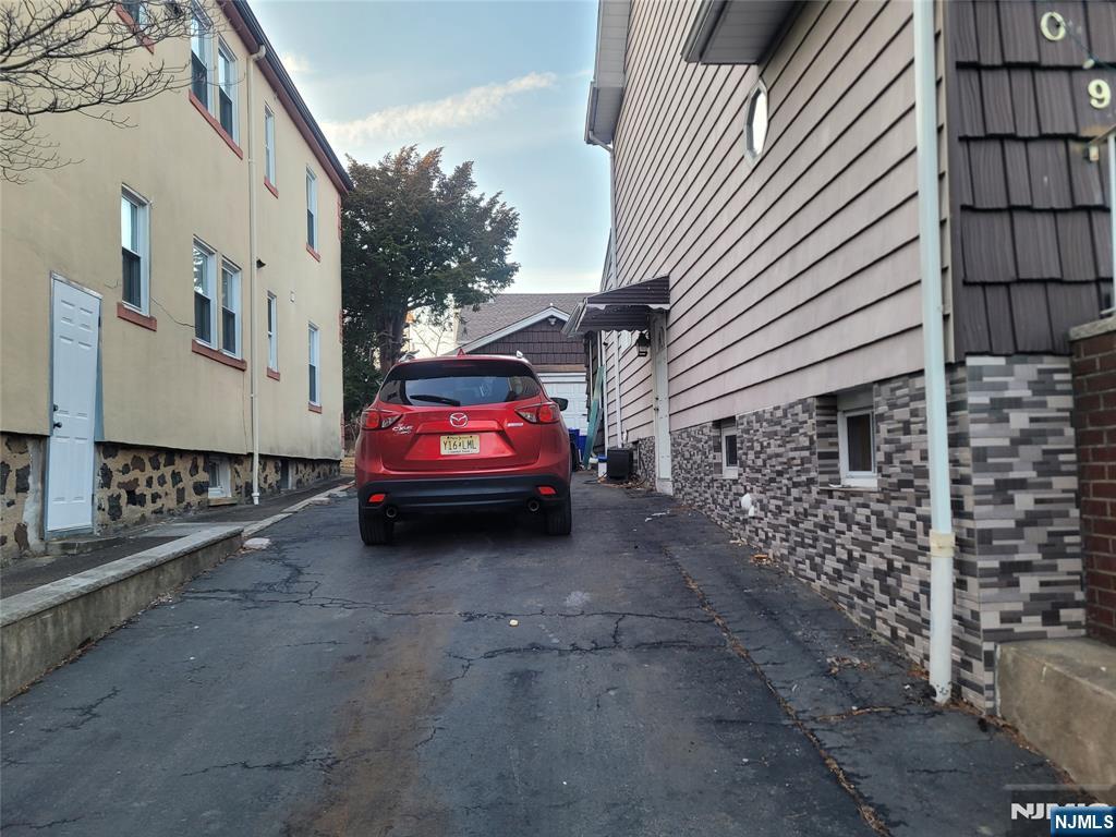 709 Kingsland Avenue Ridgefield, NJ 07657 - Photo 2 of 3 a view of a car park in front of a building