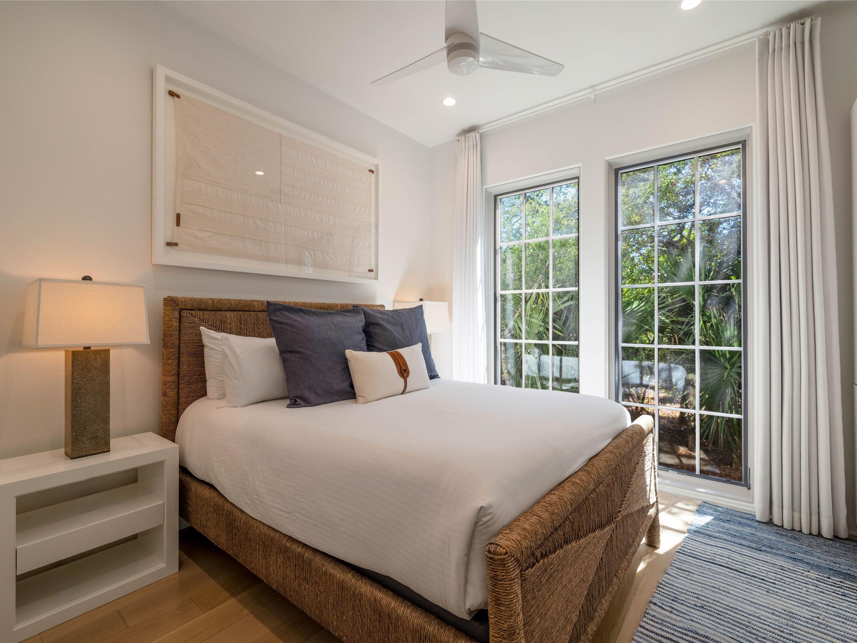 191 Sand Oaks Circle Santa Rosa Beach, FL 32459 - Photo 15 of 47 a bedroom with a large bed and a window