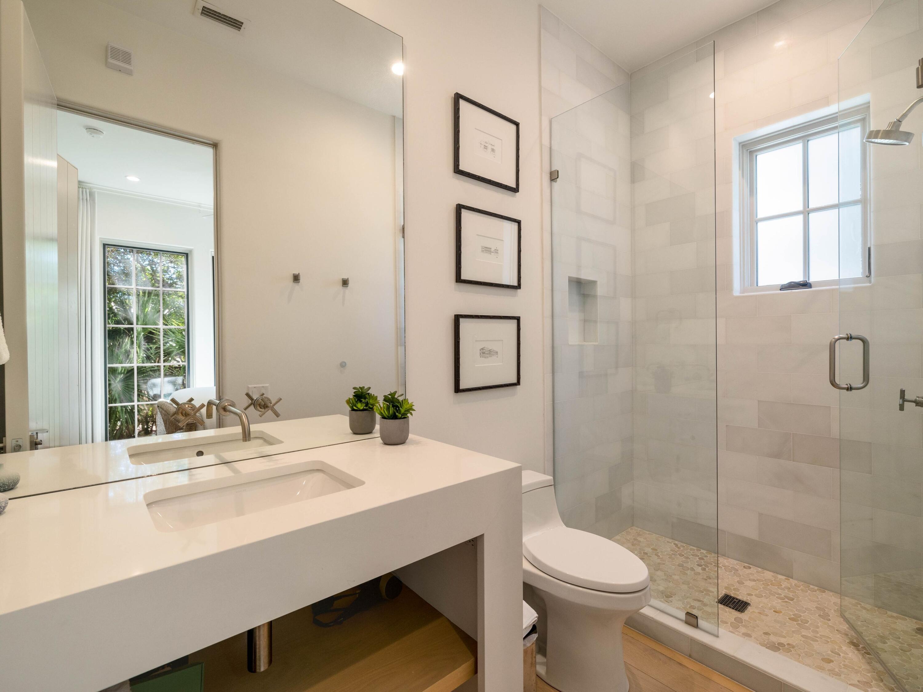 191 Sand Oaks Circle Santa Rosa Beach, FL 32459 - Photo 17 of 47 a bathroom with a sink a toilet and shower