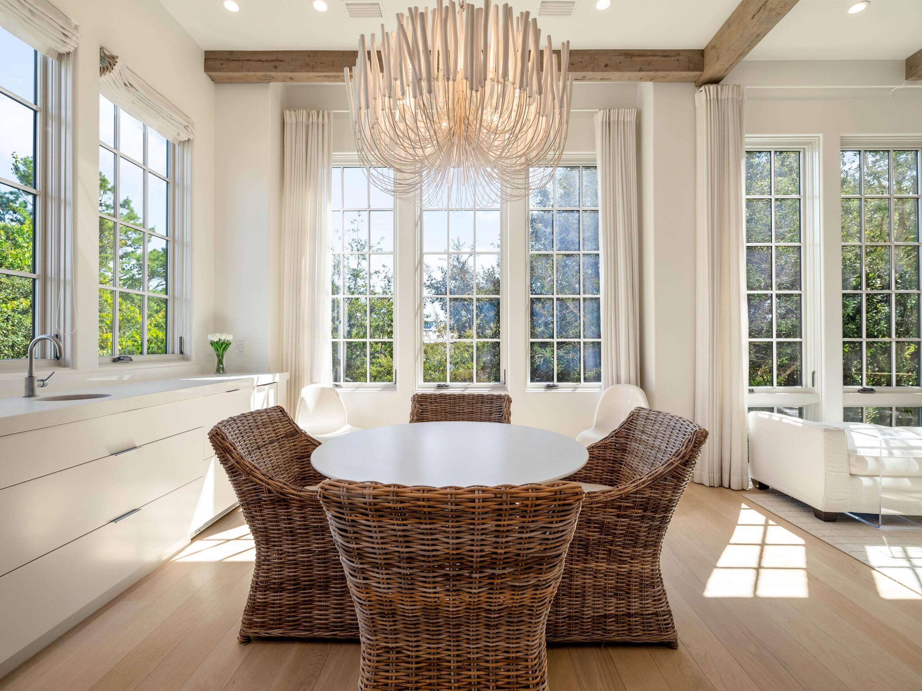 191 Sand Oaks Circle Santa Rosa Beach, FL 32459 - Photo 29 of 47 a dining room with furniture and large windows