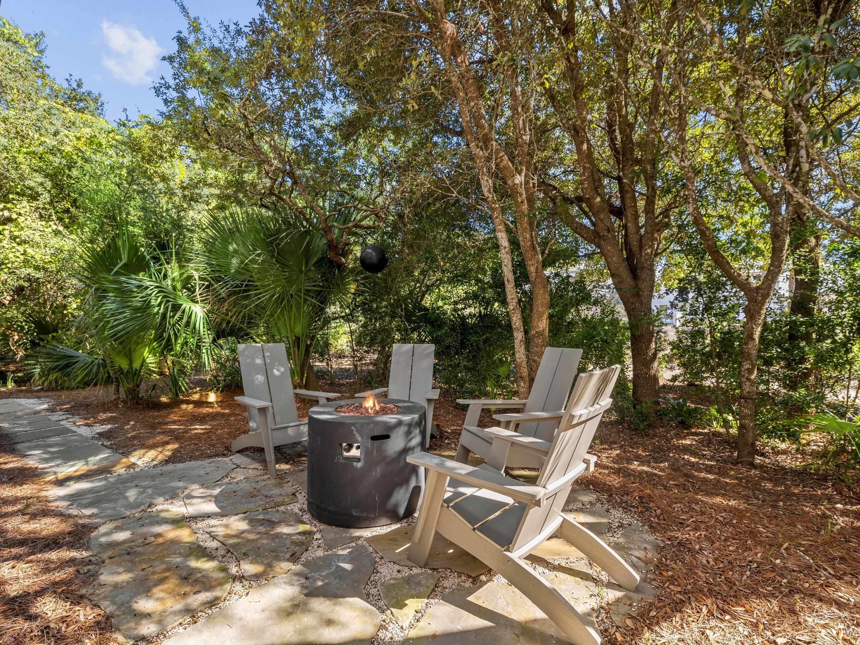 191 Sand Oaks Circle Santa Rosa Beach, FL 32459 - Photo 3 of 47 a view of backyard with outdoor seating and trees