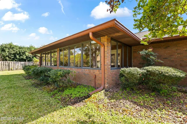 a large kitchen with stainless steel appliances kitchen island granite countertop a refrigerator and a sink