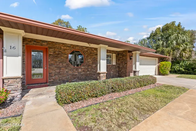 a front view of a house with a glass door