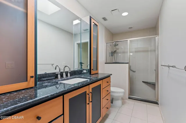 a view of a park with large trees