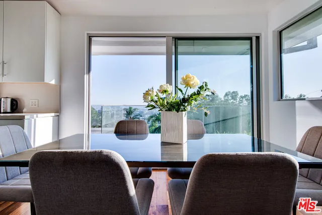 a bedroom with a large bed and large window