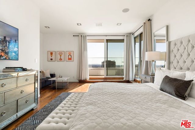 a bathroom with a shower sink and mirror