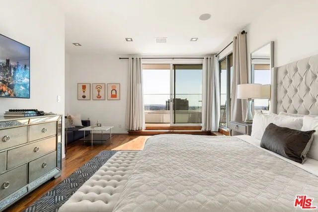 a bathroom with a shower sink and mirror