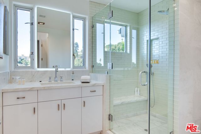 a bedroom with a large bed and a couch