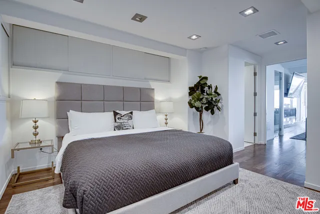 a bedroom with bed and window