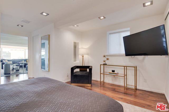 a bathroom with a double vanity sink mirror and toilet