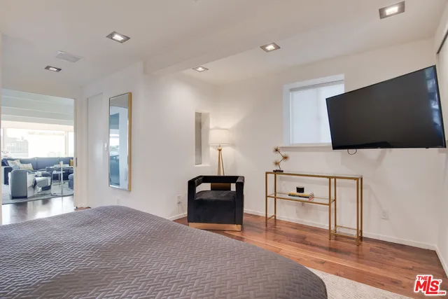 a bathroom with a double vanity sink mirror and toilet